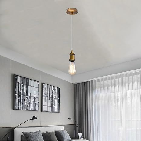 Modern bedroom with pendant light fixture, bed, and wall art.