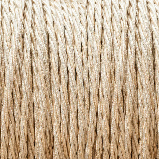 A close-up of tightly twisted beige or cream-colored cords/rope filling the frame, showing a fine woven texture.